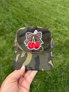 Camo hat with cherry patch.