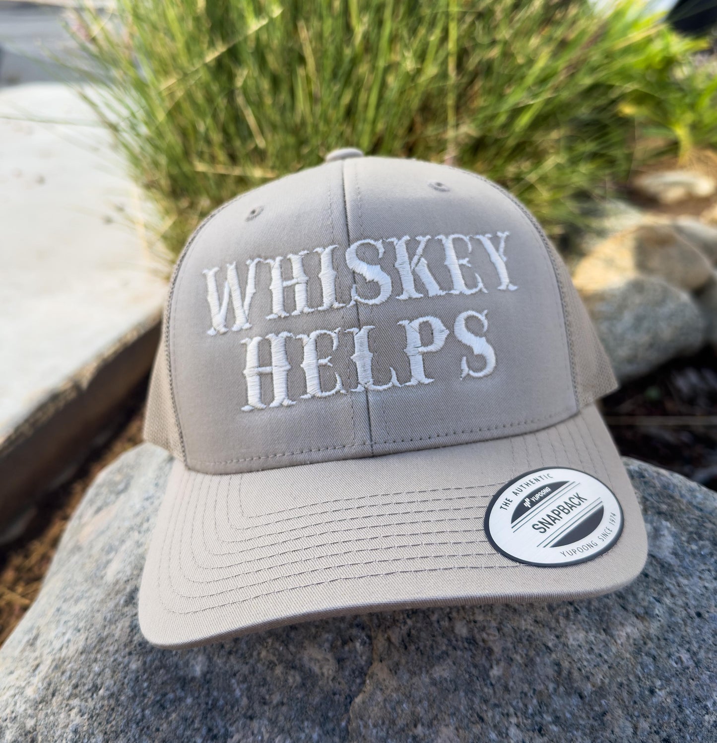 Whiskey Helps. Embroidered trucker hat.